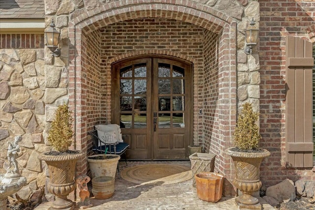 7908 London Ct, Amarillo, TX 79119 - entrance to property with stone siding, french doors, and brick siding