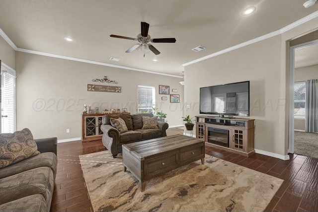 living room featuring dark wood-style floors, visible vents, and baseboards