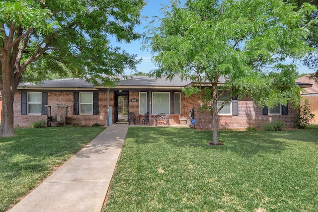 6410 Hamstead Dr, Amarillo, TX 79109 - ranch-style home featuring a front yard, brick siding, and a porch