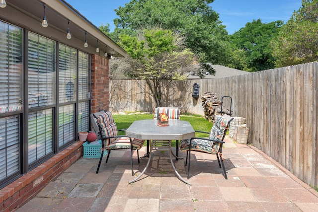 6410 Hamstead Dr, Amarillo, TX 79109 - fenced backyard with outdoor dining area and a patio area