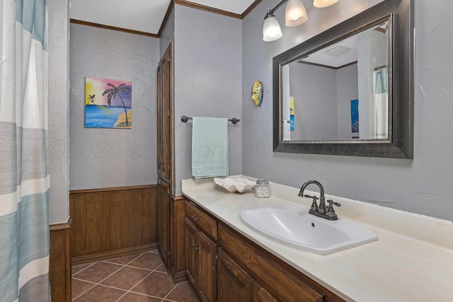 6410 Hamstead Dr, Amarillo, TX 79109 - full bathroom with vanity, a wainscoted wall, ornamental molding, wood walls, and tile patterned flooring