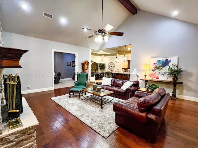7507 Continental Pkwy, Amarillo, TX 79119 - living room featuring a ceiling fan, beam ceiling, wood-type flooring, a fireplace with raised hearth, and recessed lighting