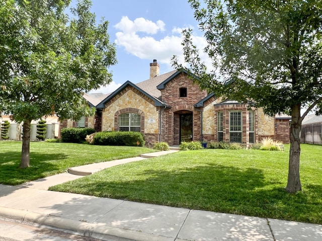 7507 Continental Pkwy, Amarillo, TX 79119 - french country style house featuring stone siding, a chimney, and roof with shingles