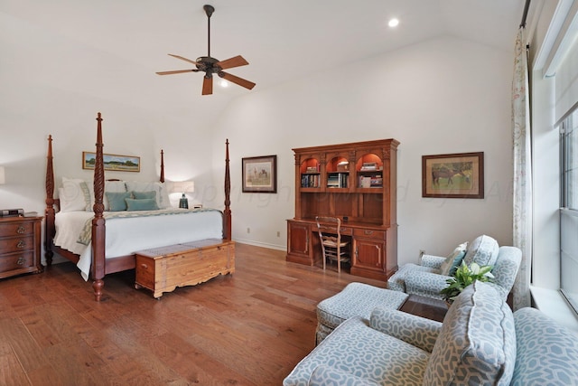 bedroom with dark hardwood / wood-style flooring, ceiling fan, and lofted ceiling