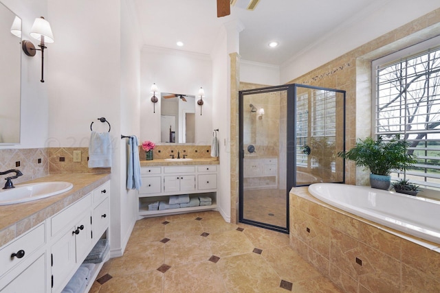 bathroom with tile patterned floors, vanity, shower with separate bathtub, and crown molding