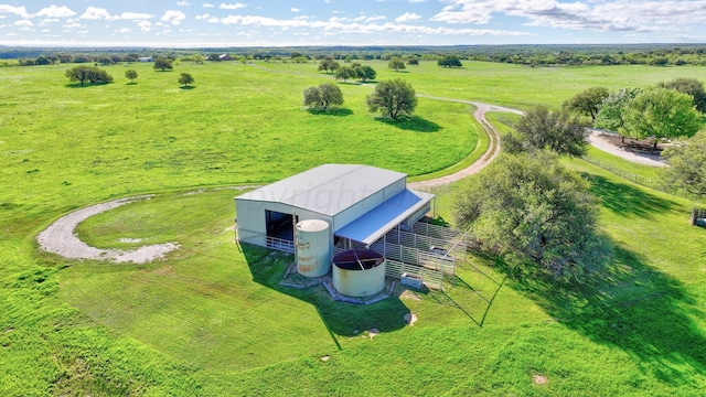 birds eye view of property with a rural view