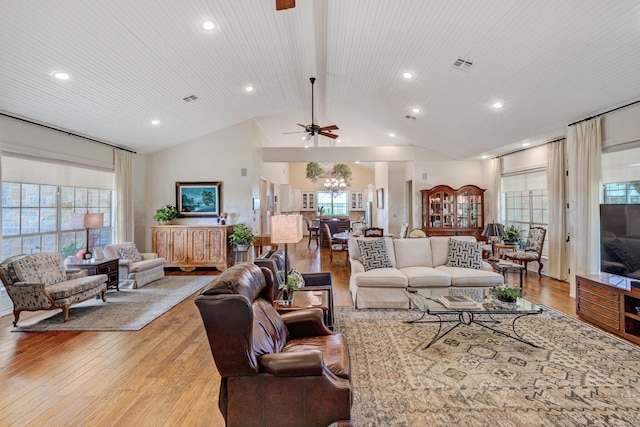 living room with wooden ceiling, ceiling fan, light wood-type flooring, and high vaulted ceiling