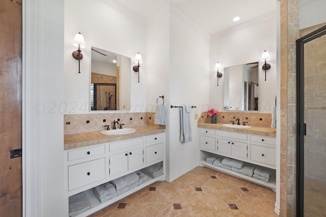 bathroom with a shower with door, tile patterned flooring, ornamental molding, vanity, and backsplash