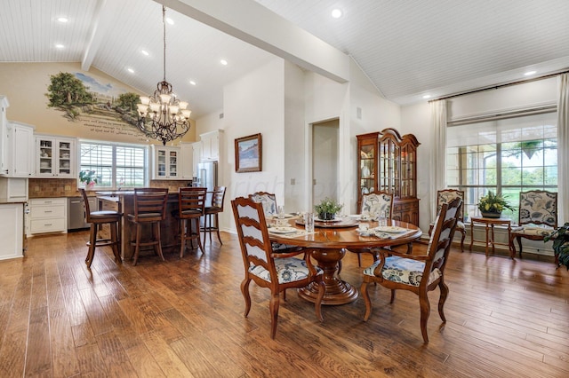 dining room with high vaulted ceiling, beamed ceiling, a chandelier, and wood-type flooring