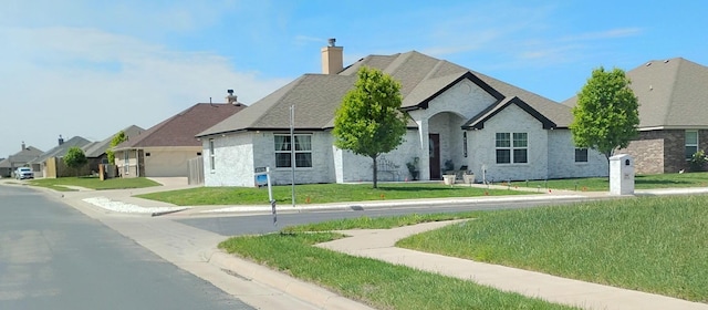 2901 Spokane Ave, Amarillo, TX 79118 - view of front of house with a chimney, a front lawn, and a residential view
