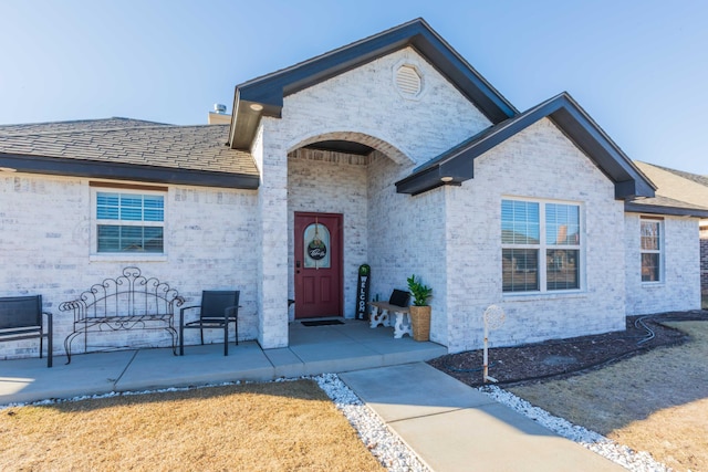 view of front of home featuring brick siding