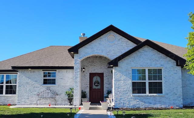 2901 Spokane Ave, Amarillo, TX 79118 - view of front of house with a chimney and brick siding