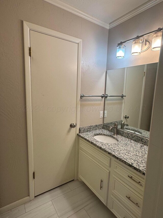 3717 Farwell Dr, Amarillo, TX 79109 - bathroom featuring ornamental molding and vanity
