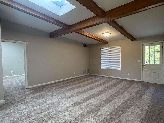 3717 Farwell Dr, Amarillo, TX 79109 - carpeted empty room with a skylight, baseboards, and beam ceiling
