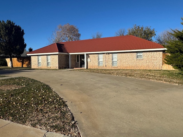 3717 Farwell Dr, Amarillo, TX 79109 - ranch-style home with a tiled roof, brick siding, and driveway