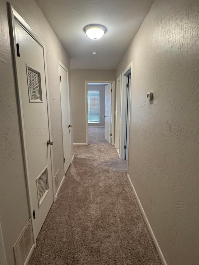 3717 Farwell Dr, Amarillo, TX 79109 - hall featuring carpet flooring, a textured wall, and baseboards