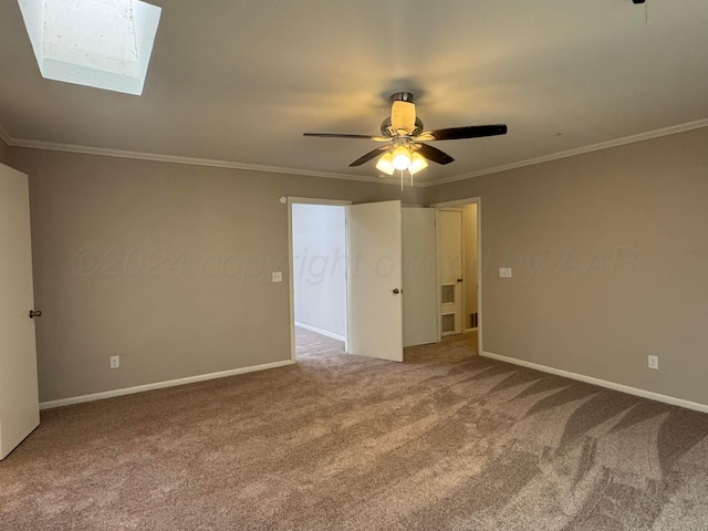 3717 Farwell Dr, Amarillo, TX 79109 - carpeted empty room featuring crown molding, baseboards, a ceiling fan, and a skylight