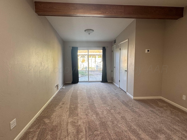 3717 Farwell Dr, Amarillo, TX 79109 - spare room with beam ceiling, carpet flooring, and baseboards