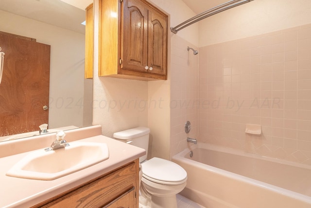 full bathroom with toilet, tiled shower / bath combo, and vanity