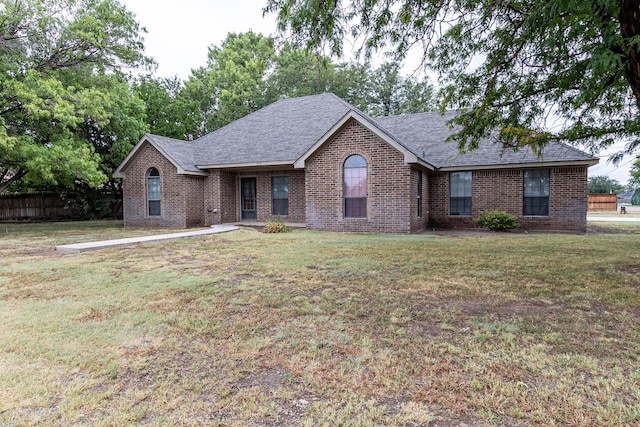 ranch-style home featuring a front yard