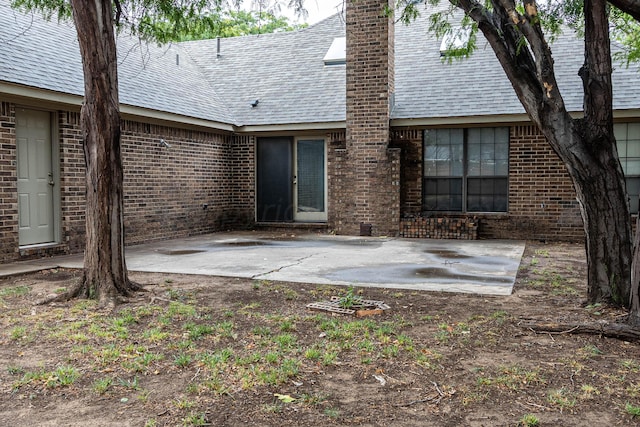 back of property featuring a patio area