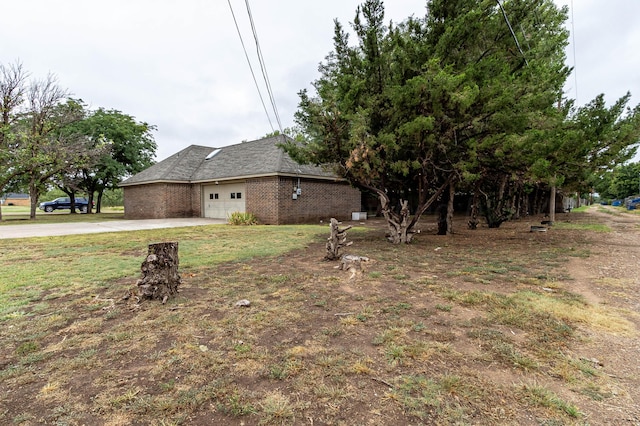 view of side of home with a garage