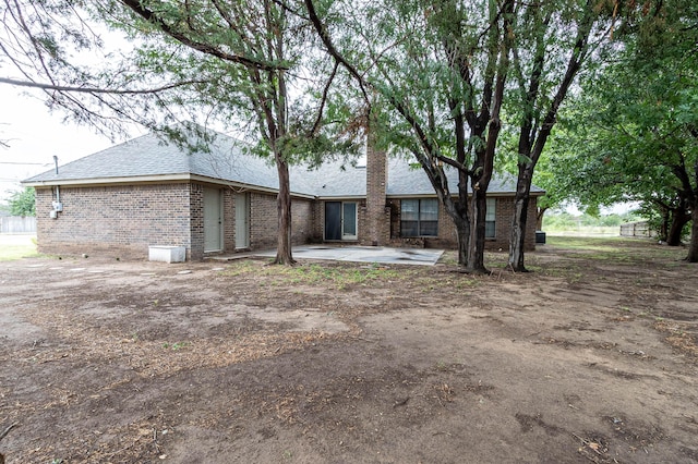 back of property featuring a patio area