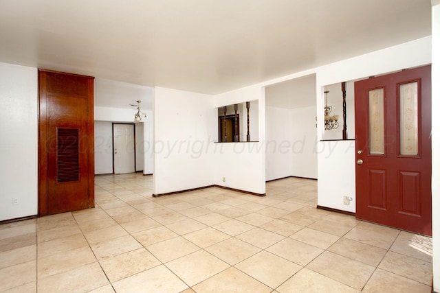 3115 Palm St, Amarillo, TX 79107 - unfurnished room featuring baseboards and light tile patterned floors