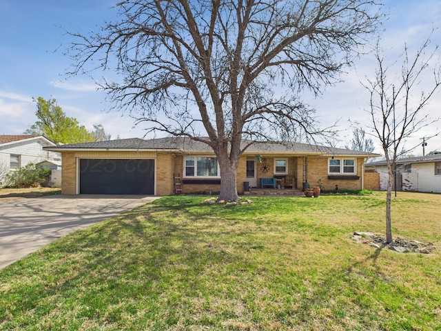 ranch-style home with brick siding, a front yard, driveway, and a garage