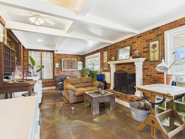 living room featuring beamed ceiling, concrete flooring, brick wall, and a brick fireplace