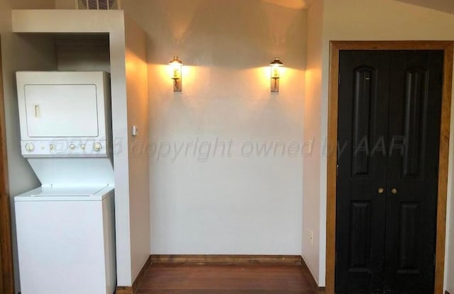 2404 S Harrison St, Amarillo, TX 79109 - washroom with stacked washer / dryer, wood finished floors, and baseboards