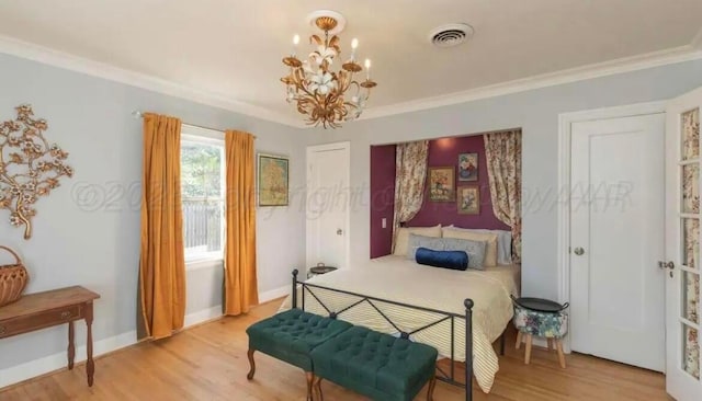 2404 S Harrison St, Amarillo, TX 79109 - bedroom with wood finished floors, a chandelier, baseboards, and crown molding