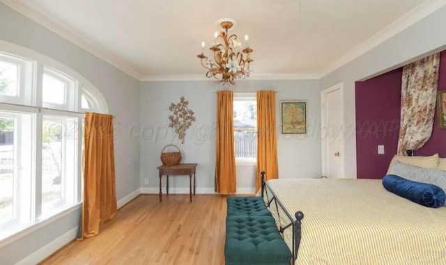 2404 S Harrison St, Amarillo, TX 79109 - bedroom featuring light wood-type flooring, a chandelier, crown molding, and baseboards