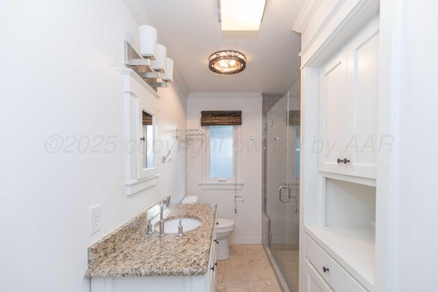 1218 N Charles St, Pampa, TX 79065 - bathroom with vanity, a shower stall, crown molding, and tile patterned floors