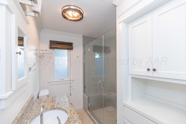 1218 N Charles St, Pampa, TX 79065 - bathroom featuring vanity, a shower stall, and crown molding