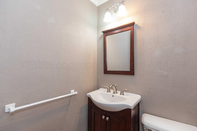 1218 N Charles St, Pampa, TX 79065 - bathroom with vanity and toilet