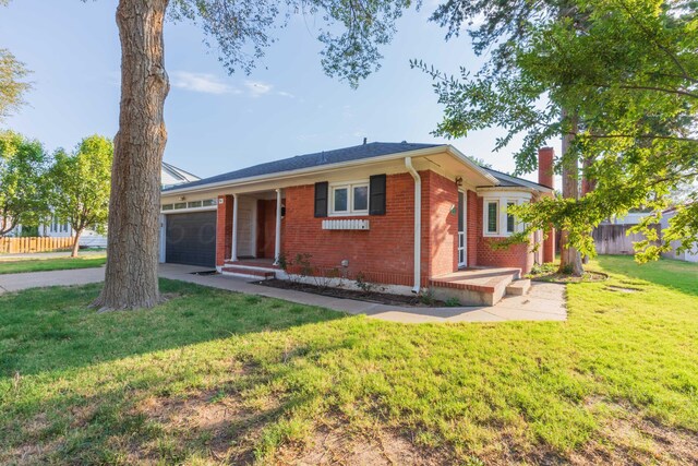 1218 N Charles St, Pampa, TX 79065 - single story home featuring a garage, brick siding, driveway, and a chimney