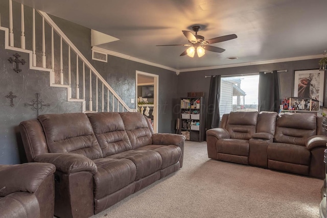 carpeted living room with ceiling fan and ornamental molding