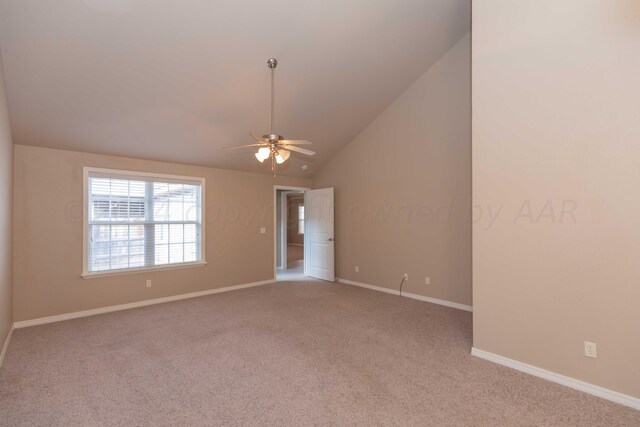 6701 Mosley St, Amarillo, TX 79119 - unfurnished room featuring ceiling fan, light carpet, baseboards, and vaulted ceiling