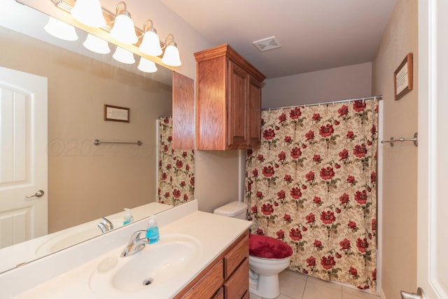 6701 Mosley St, Amarillo, TX 79119 - bathroom with tile patterned floors, toilet, vanity, and a shower with curtain