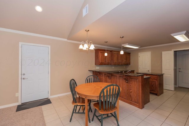 6701 Mosley St, Amarillo, TX 79119 - dining room with ornamental molding, light tile patterned floors, a chandelier, lofted ceiling, and baseboards