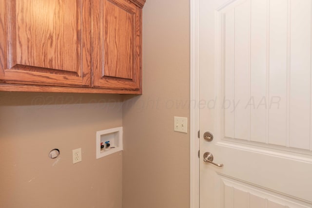6701 Mosley St, Amarillo, TX 79119 - clothes washing area featuring cabinet space and washer hookup