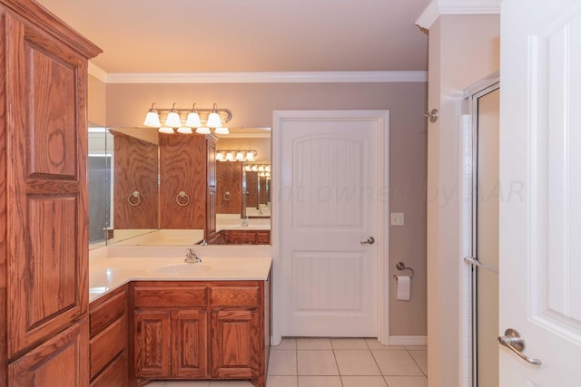 6701 Mosley St, Amarillo, TX 79119 - bathroom with tile patterned floors, vanity, crown molding, baseboards, and a shower with shower door