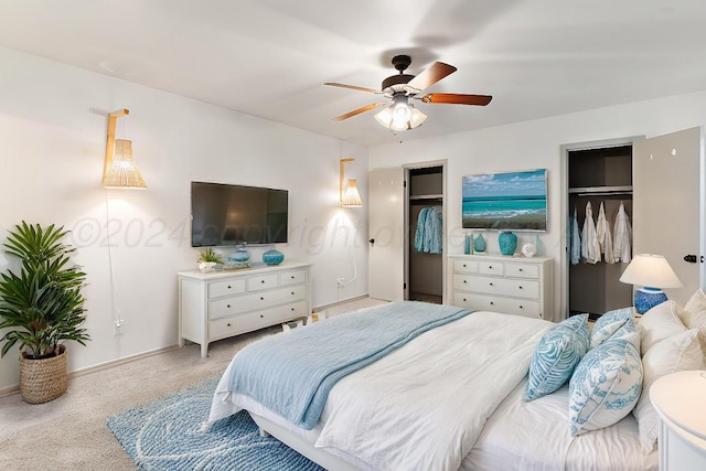 bedroom with ceiling fan and light colored carpet