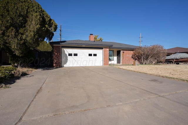 ranch-style home featuring a garage