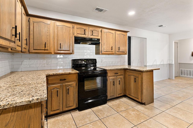 kitchen with kitchen peninsula, backsplash, black electric range oven, and light stone countertops