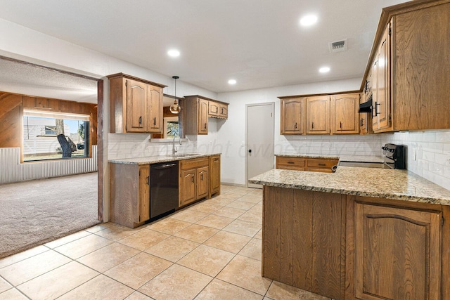 kitchen featuring light stone countertops, sink, light colored carpet, and black appliances