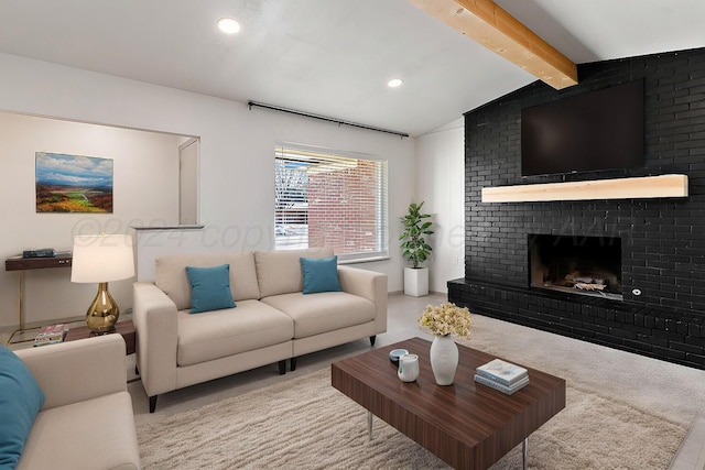 living room featuring light carpet, a fireplace, and lofted ceiling with beams