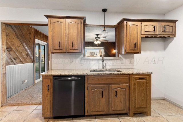 kitchen with sink, stainless steel dishwasher, ceiling fan, decorative backsplash, and light stone countertops