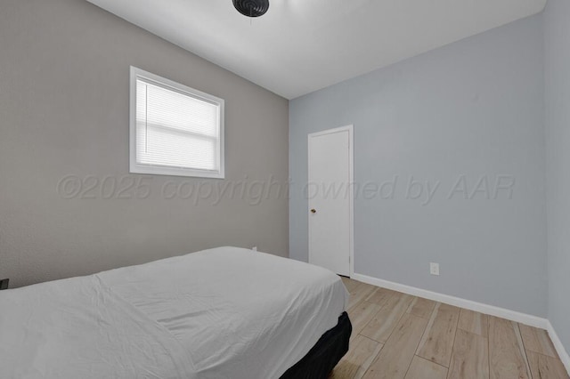 912 W Bonita Ave, Amarillo, TX 79108 - bedroom featuring baseboards and light wood-style flooring